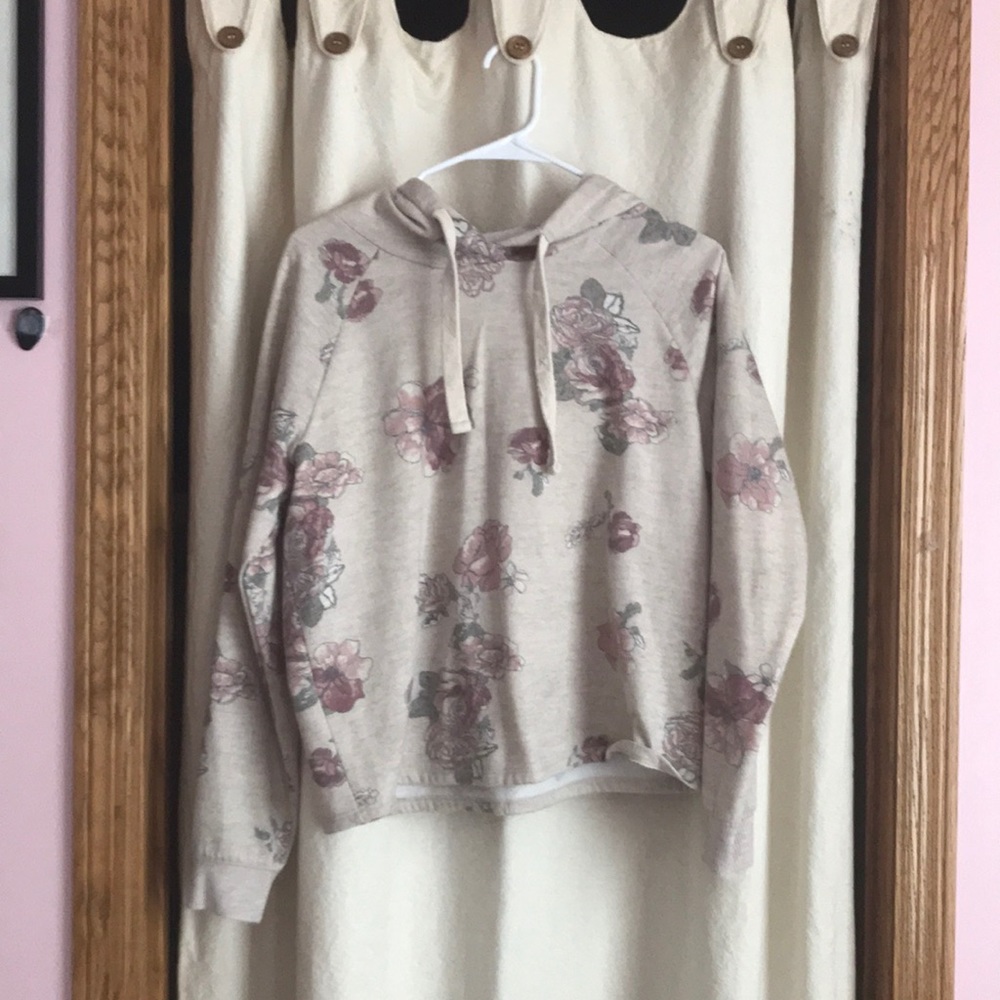 S sweatshirt with a tan base color and pink flowers.